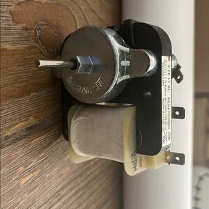 Silver and Black Motor Component